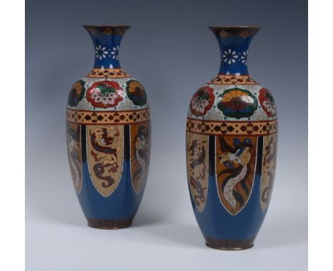 A pair of Chinese cloisonné enamel hexagonally pannelled ovoid vases, decorated in polychrome with stylized flowers, phoenix 
