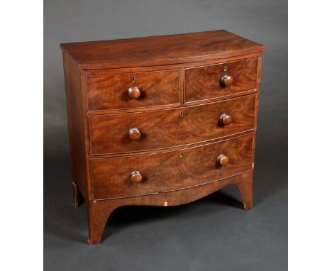 An early Victorian mahogany bow fronted chest, of two short and three long graduated cockbeaded drawers, turned handles, shap