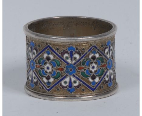 A Russian silver and cloisonne enamel napkin ring, brightly decorated with a band of flowers and lozenges, 5cm diam, 84 zolot