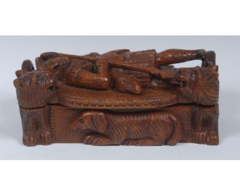 A late 19th century Scottish novelty sycamore table snuff box, the hinged cover boldly carved in high-relief with a Highlande