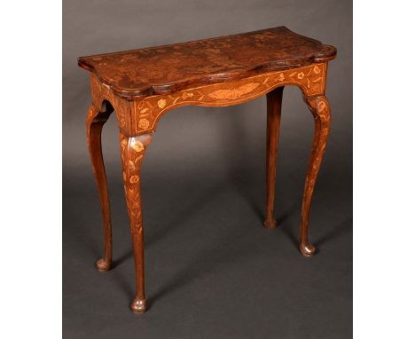 A 19th century Dutch mahogany and marquetry shaped serpentine card table, folding top enclosing an inset baize lined playing 
