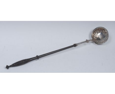 A Victorian Rococo Revival silver punch ladle, the bowl embossed with flowers, thistles and a C-scroll cartouche, 'Onslow' he