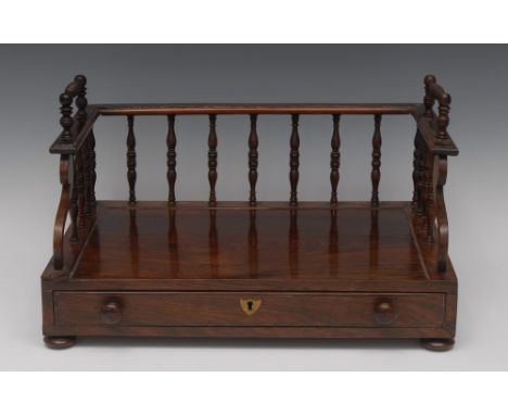 A George IV rosewood book trough/carrier, three-quarter superstructure surmounted by twin carrying handles, the front with sc