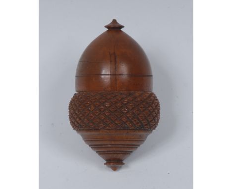 A 19th century cocquilla nutmeg grater, as an acorn, screw-fitting cover enclosing a steel rasp, turned finial, 7.5cm long, c