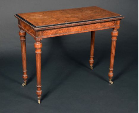 A Victorian walnut rectangular card table, in Louis XVI style, folding crossbanded top enclosing an inset baize lined playing