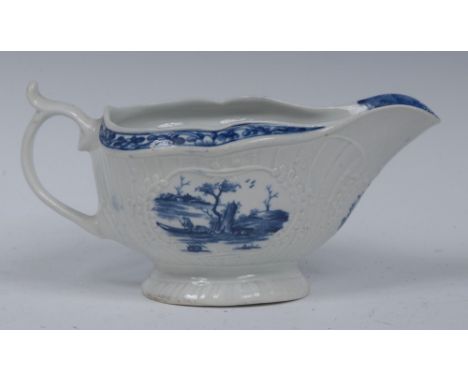 A Worcester Little Fisherman pattern sauce boat, loop handle, scroll thumb piece, painted in underglaze blue within lobed car