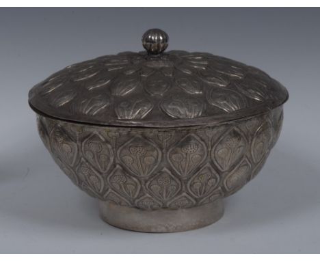 An Eastern silver coloured metal bowl and cover, possibly Indian, fluted ball finial, chased overall with stylised flowers wi