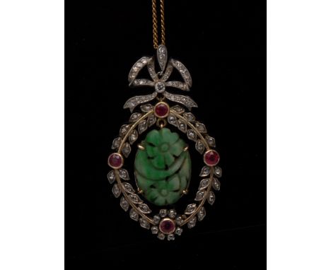 A jade diamond and ruby pendant, central oval carved jade floral tablet, surrounded by a diamond encrusted floral wreath fram