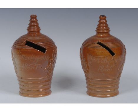A Brampton brown salt glazed stoneware beehive money box, applied with Cupids at work, inscribed Jas H Hyson, 1856, turned fi