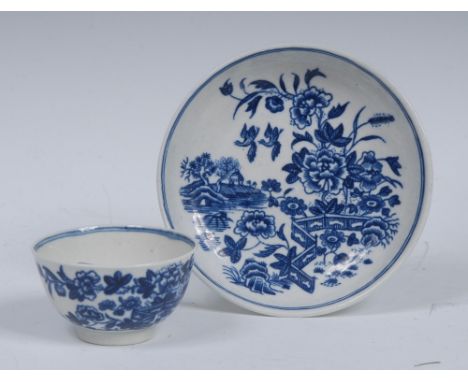 A Worcester Fence pattern miniature pattern tea bowl and saucer, decorated in underglaze blue with fence, peonies and flowers