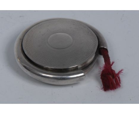 A Victorian silver circular novelty combination vesta case and taper lighter, hinged cover engine turned within a horse-shoe 
