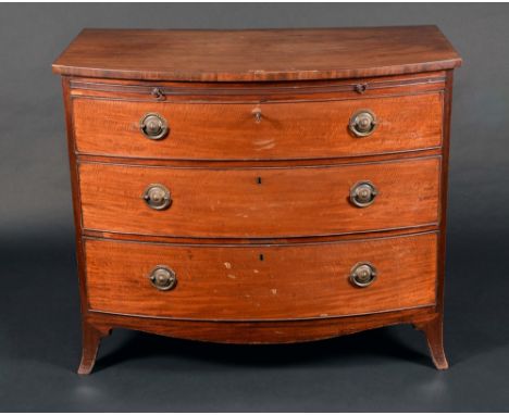 A Regency mahogany bow fronted bachelor's chest, slightly oversailing top above a slide and three long graduated cockbeaded d