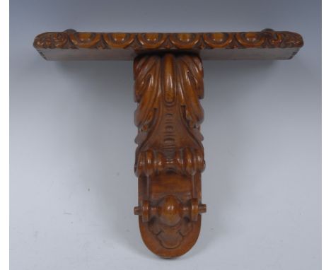 A Victorian walnut wall bracket, oversailing rectangular plateau with dart-and-egg frieze, above an acanthus scroll, 19cm hig