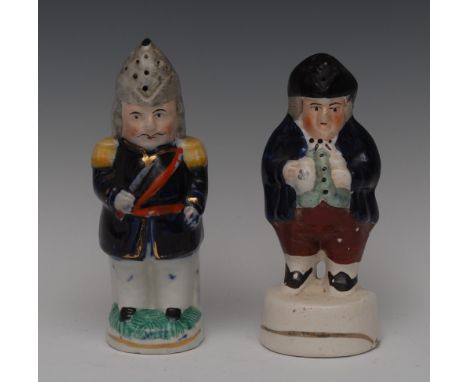 A Staffordshire Policeman pepper pot, he stands holding his truncheon, wearing  a helmet, cobalt blue jacket with yellow epau