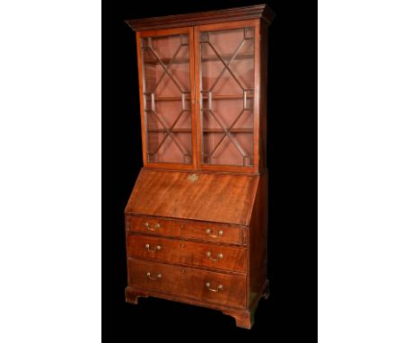 George III mahogany bureau bookcase, outswept cornice and Greek key frieze above a pair of astragal glazed doors enclosing ad