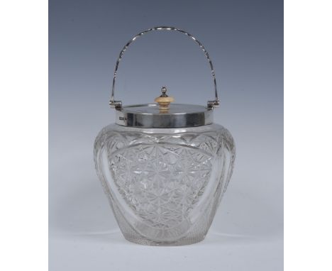 An Edwardian silver mounted hobnail-cut clear glass ovoid biscuit barrel, swing handle cast with leafy scrolls, knop finial, 