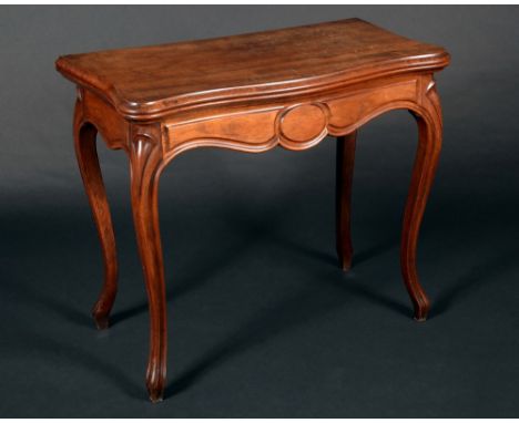 A 19th century mahogany serpentine card table, folding top enclosing an inset leather playing surface, above a deep frieze, s