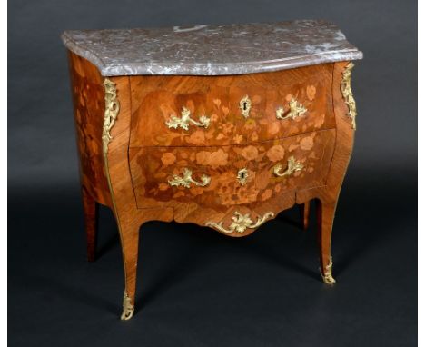 A Louis XV style gilt metal mounted mahogany and marquetry bombe shaped commode, of small proportions, marble top above two g
