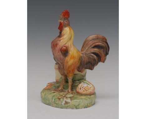 A Sampson Hancock Derby cockerel, naturalistically modelled, standing before a basket, the base with corn ears and bowl, 18.5