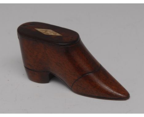 An early 19th century mahogany novelty snuff box, as a shoe, sliding cover inlaid with a monogrammed bone lozenge, delineated