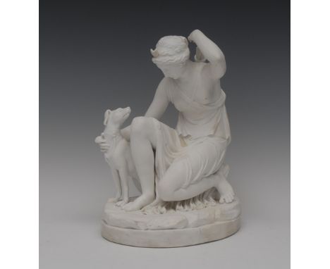 A Parian figure, Diana, kneeling, with her hound getting  an arrow out of her quiver, oval base, 27cm high, c.1900