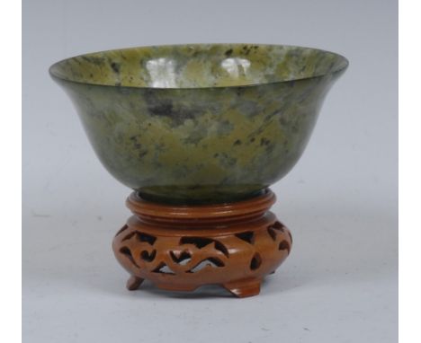 A jade flared cylindrical bowl,  10cm diam, pierced stand