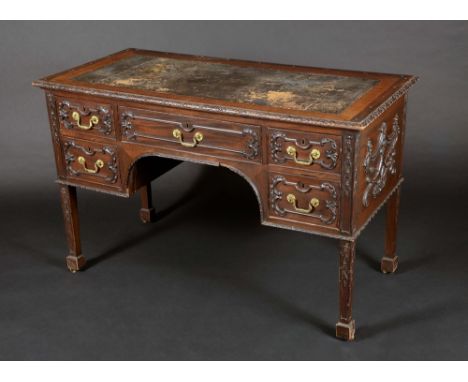 A Chippendale Revival mahogany desk, inset tooled leather writing surface above and arched frieze with three cock-beaded draw