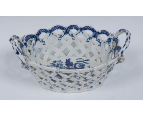 A Worcester Pine-cone pattern shaped oval basket, printed in underglaze blue with peony between two pine cones and a pomegran