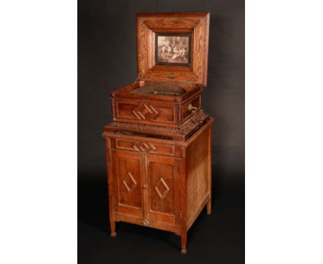 A late 19th century oak Polyphon, by P van Leeuwen & ZN, Amsterdam, horizontal mechanism playing 40cm discs, hinged top with 