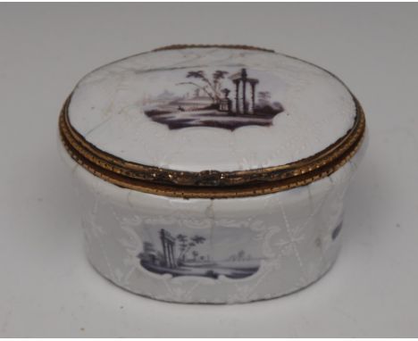 An 18th century enamel oval table snuff box, decorated in puce with vignettes of Classical ruins, on an opaque ground applied