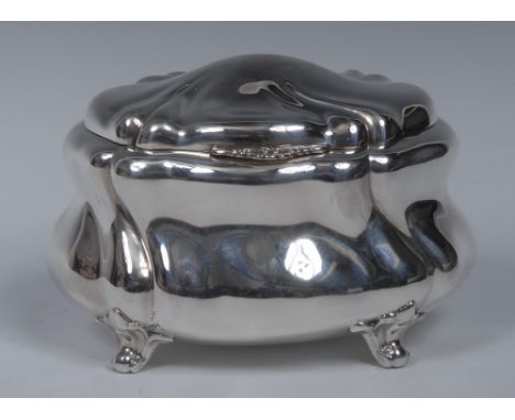 A German silver bombe shaped tea caddy or sucrier, hinged cover with shell thumbpiece, leafy scroll feet, 15.5cm wide, halbmo