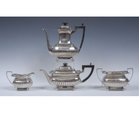 A Victorian silver half-fluted boat shaped tea and coffee service, comprising teapot, coffee pot, milk jug and sugar basin, k