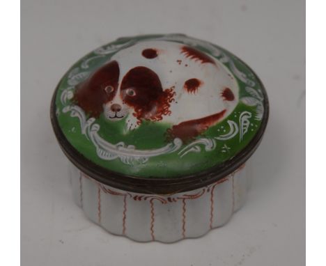 A George III South Staffordshire enamel novelty circular snuff box, as a spaniel, the recumbent dog sits within a frame of C 