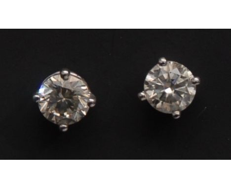 A pair of diamond stud earrings, each round brilliant cut diamond, approx 0.75ct, quarter claw set, total estimated diamond w