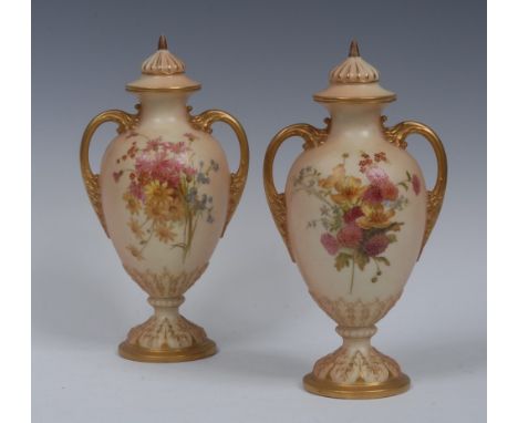 A pair of Royal Worcester pedestal ovoid two handled vases and covers, printed and painted with colourful summer flowers, lea