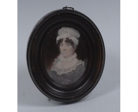 English School (early 19th century), a portrait miniature, of a lady, bust-length, wearing blue ribbon and mop cap above ring