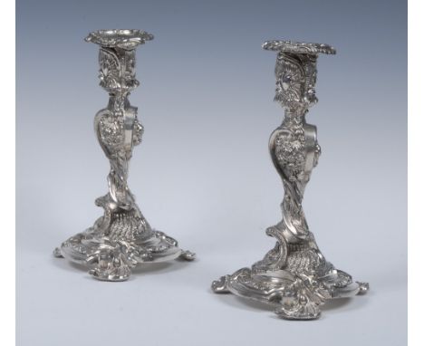 A pair of William IV old Sheffield plate candlesticks, attributed to Henry Wilkinson & Co, embossed throughout with shells, f