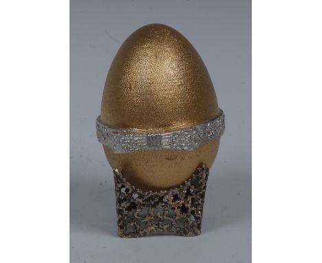 Stuart Devlin (Bn.1931) - an Elizabeth II parcel-gilt silver Surprise Egg, ribbon-tied cover enclosing lovebirds beneath an a