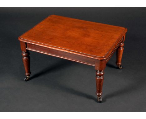 A Victorian mahogany miniature rounded rectangular dining table, moulded top above a deep frieze, turned legs, ceramic caster