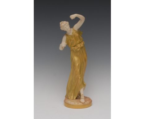 A Royal Worcester figure, of a dancing maiden, modelled by James Hadley, she stands, draped in a long flowing dress of burnis