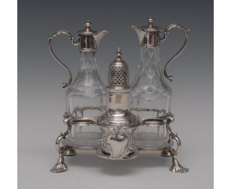 A George III three-piece cruet stand, with acanthus double scroll handles, double scroll legs, shell feet, vacant cartouche, 