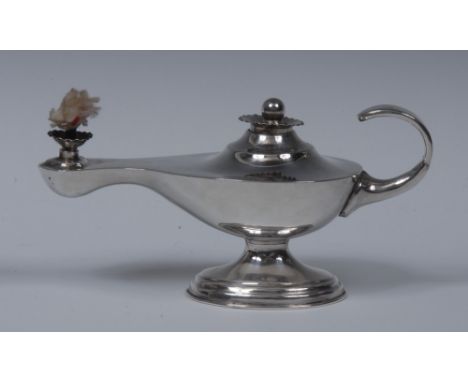 A George V silver novelty table cigar lighter, as a Roman lamp, flame finial, flying-scroll handle, 13cm long, London 1913, 3