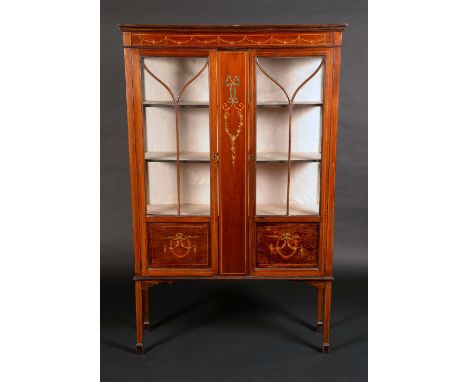 An Edwardian painted mahogany display cabinet, moulded cornice and deep frieze above a pair of glazed doors divided by a broa