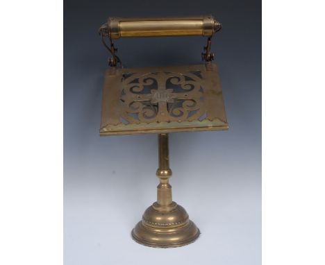 A Victorian Gothic Revival brass ecclesiastical lectern, the rectangular plateau pierced with an equilateral cross and christ