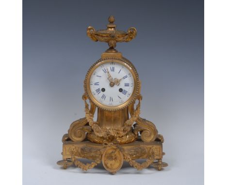 A Louis Philippe ormolu mantel clock, the 10cm ceramic dial within a beaded bezel, bevelled glass, blue Roman chapter with ou