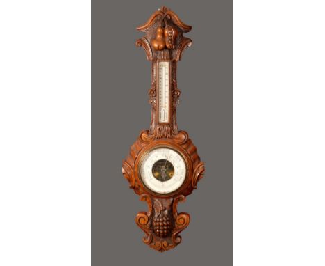 A Victorian oak barometer,  19cm white dial, the case heavily carved with bold pea pods, pear and grapes, leafy scroll border