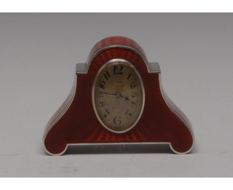 An early 20th century Swiss silver and crimson enamel miniature timepiece, 2.5cm oval dial with Arabic numerals, 8-day key wo