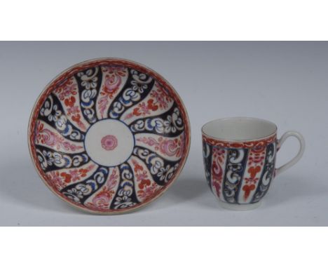 A Worcester Queen Charlotte pattern coffee cup and saucer, decorated with alternating whorls in cobalt blue, iron-red and pin