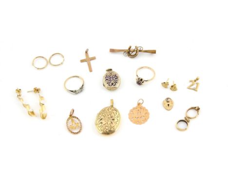 Group of gold jewellery including an engraved locket, another with enamel detail, heart clasp and charms all 9 ct and a Leban