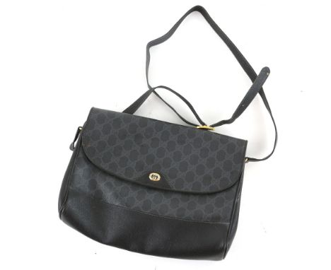 Two Vintage Gucci handbags, one black silk evening with detachable gilt chain, the other a shoulder bag in black house monogr